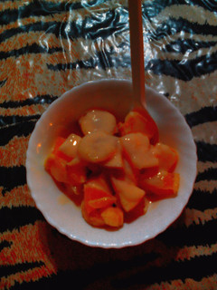 A picture of Fruit salad with custard.