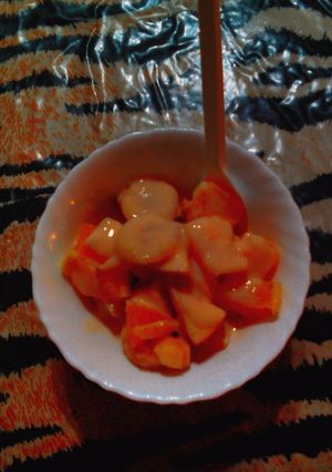 A picture of Fruit salad with custard.