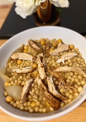 A picture of Moghrabieh - semolina dough with chicken.