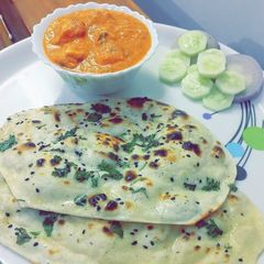 Butter Creamy Chicken with Tawa Butter Naan A picture of Butter Creamy Chicken with Tawa Butter Naan.