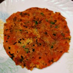A picture of Egg Bhurji Stuffed Tomato Paratha.