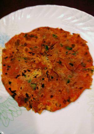 A picture of Egg Bhurji Stuffed Tomato Paratha.