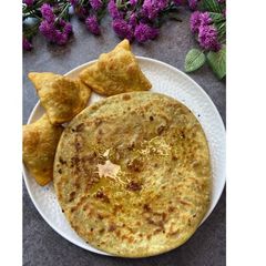 A picture of Puran Poli Samosa - A twist on the classic dish.