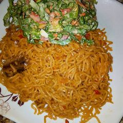 A picture of Indomie with salad.
