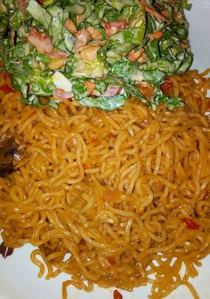 A picture of Indomie with salad.