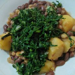 A picture of Stewed potatoes githeri with greens.