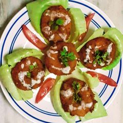 A picture of Schezwan Veggie Donuts.