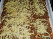 Una foto de canelones de espinaca y picadillo