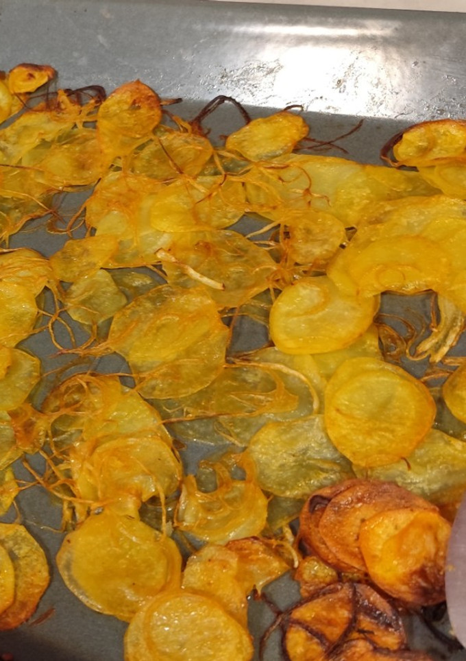 Una foto de Patatas con cebolla