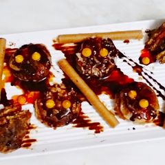 A picture of Chocolate cookies with chocolate sauce.