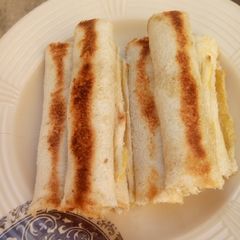 A picture of Scrambled Eggs Bread Rolls.
