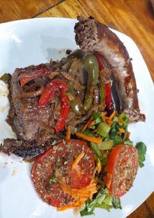 Una foto de Asado americano a la chapa, rehogadas, apio, zanahoria y tomates