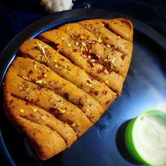 A picture of Dominos Style Stuffed Garlic Bread Without Yeast.