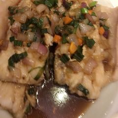 A picture of Steamed vegetable salmon.