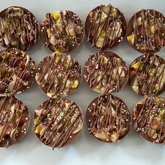 A picture of Chocolate, pistachios and almond florentines.
