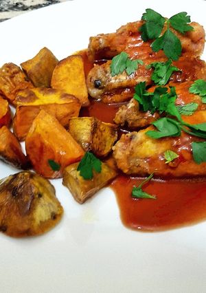 Una foto de Buffalo wings (alitas de pollo con salsa buffalo)