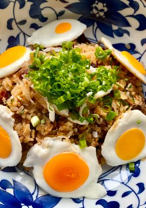 A picture of Fried Rice with Small Fried Eggs.