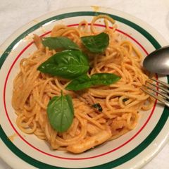 A picture of Cherry tomatoes and fresh basil  ,garlic  and Parmesan pasta.