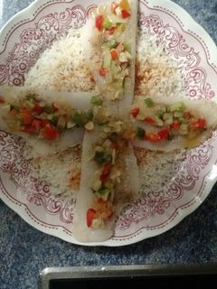 Una foto de Cama de arroz con merluza