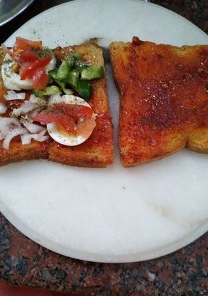 A picture of Schezwan egg sandwich.
