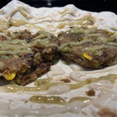 A picture of Roasted Garlic & Cilantro Lime Veggie Burger Tortilla Wrap.