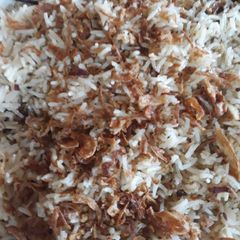 A picture of Zeera rice with fried onion.