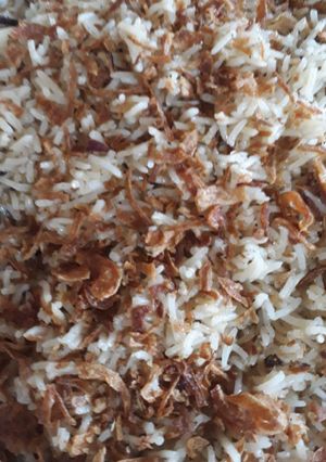 A picture of Zeera rice with fried onion.