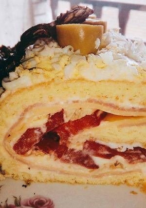 Una foto de Pionono de pollo, jamón y queso