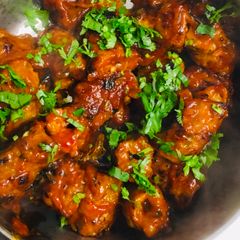 A picture of Readymade kebab in spicy sauce.