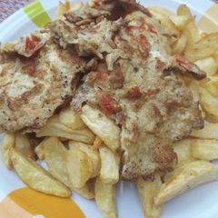 A picture of Fried patetoes and egg.