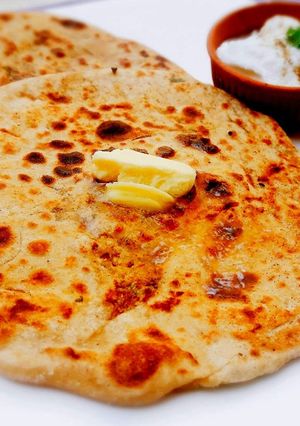 A picture of Aloo ka Paratha with Raw Potatoes.
