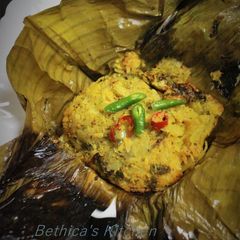 A picture of Bandakophir Paturi (Cabbage cooked in Banana Leaf).