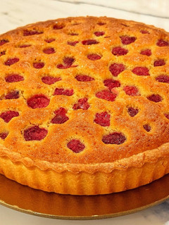 A picture of Almond and raspberry frangipane tart.