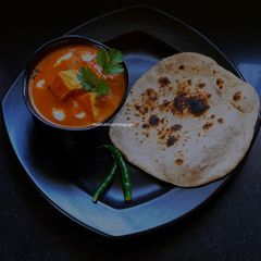 A picture of Paneer Butter Masala & Tandoori Roti.
