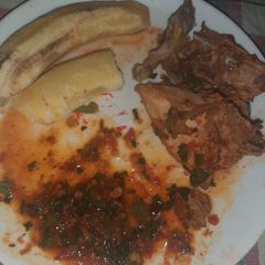 A picture of Chicken stew and banana.