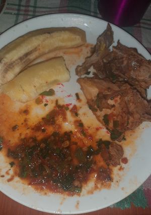 A picture of Chicken stew and banana.