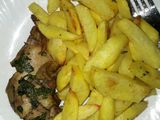 Baked chicken served with fries