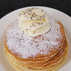 A picture of Pancakes with homemade ice cream.