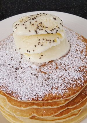 A picture of Pancakes with homemade ice cream.