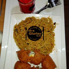 A picture of Pasta with moimoi and carrots juice.