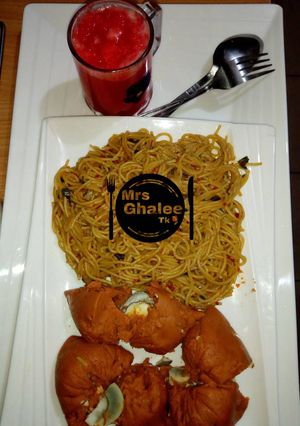 A picture of Pasta with moimoi and carrots juice.