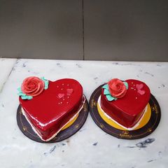 A picture of Blood red heart shape cake.