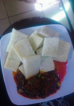 A picture of Yam and palm oil pepper sauce.