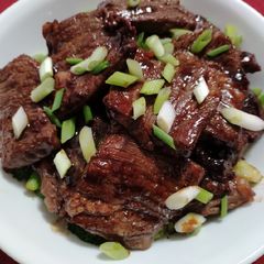A picture of Beef short ribs with sweet soy glaze.
