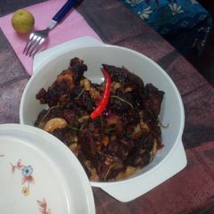 A picture of Chicken65 with macaroni pasta.