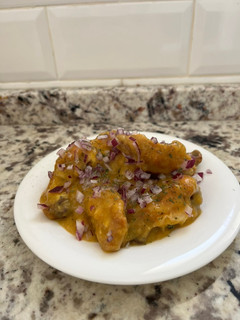 Una foto de Alitas de pollo con salsa de mango en airfryer