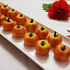 A picture of Apple-shaped Kaju Sweets.