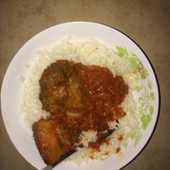 A picture of Pork stew with rice.