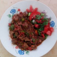 Stewed liver and kachumbari A picture of Stewed liver and kachumbari.