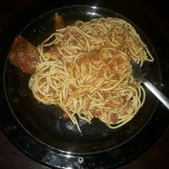A picture of Jollof spaghetti and chicken.